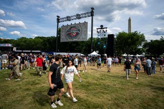 Attendees gather at the Ultimate Fighting Championship Fan Fest on the Ellipse ahead of the upcoming UFC Freedom 250 fight on the South Lawn of the White House on June 13